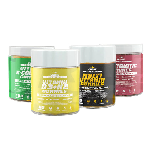 Four containers of QUAKE supplements: B-Complex Gummies, Vitamin D3+K2 Gummies, Multi Vitamin Gummies and Postbiotic Gummies on a white background.