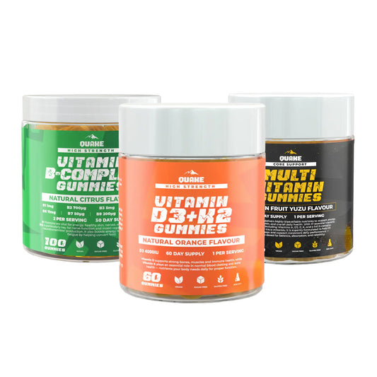 Three containers of QUAKE supplements: B-Complex Gummies, Vitamin D3+K2 Gummies and Multi Vitamin Gummies on a white background.